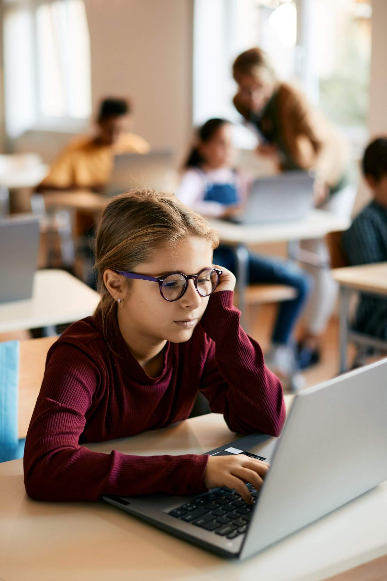 Schoolgirl e-learning on laptop